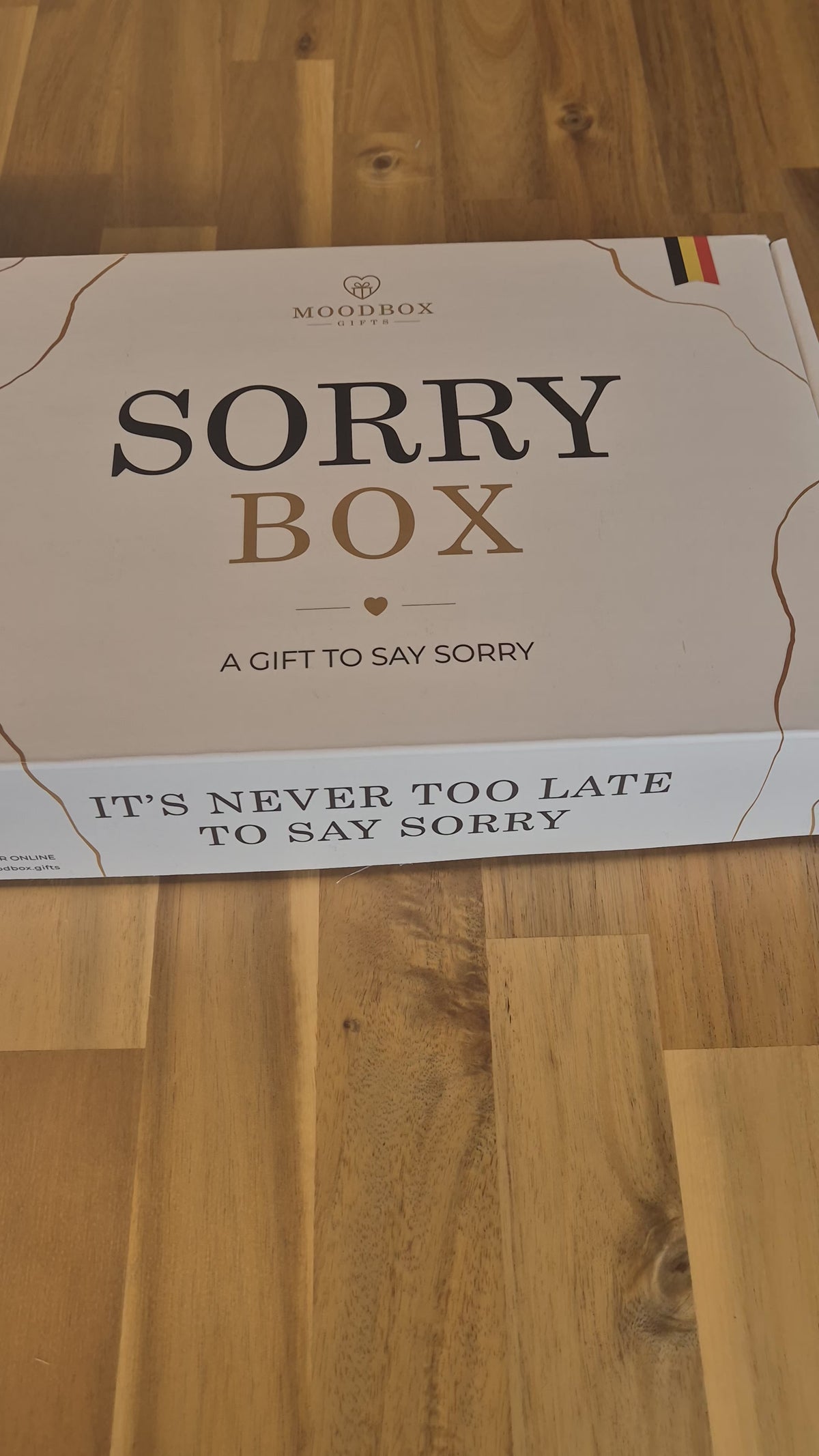 Moodbox Sorry Gift Box featuring Belgian chocolate, premium coffee, tea and delicious sweet treats, presented in an elegant gift box with a personalized message card. A thoughtful way to say sorry, make amends or send a sincere gesture to someone important, with delivery across Europe.